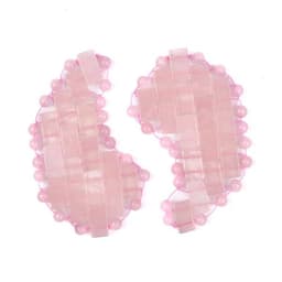 Rose quartz eye patches in soft pink hues, featuring a textured design of beads and geometric shapes.