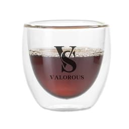 A transparent double-layer glass coffee cup containing a dark drink, featuring a logo on the front.