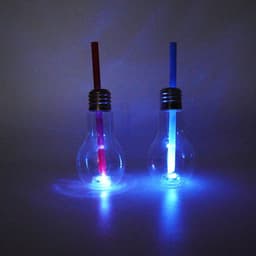 A drink bottle set featuring two light bulb-shaped cups with red and blue straws, illuminated with LED lights.
