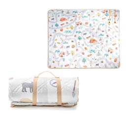 A rolled-up picnic blanket with a carrying strap, featuring a colourful nature-themed design on a white background.