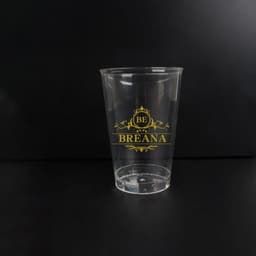 A clear 12 oz. eco-friendly RPET plastic cup with a gold logo design.
