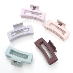 A set of five wheat straw hair claw clips in pastel pink, lavender, mint green, and brown colours, featuring a logo on one clip.