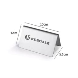 A stainless steel table sign with a sleek, polished finish, featuring a logo, measuring 10 cm by 6 cm.