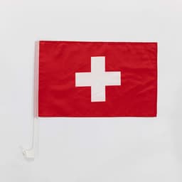A custom car flag featuring a red background with a white cross and a mounting clip.
