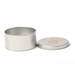 A round metal container in silver with a top lid, featuring a logo on the lid.