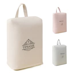 A beige travel shoe storage bag with a handle, featuring a branding logo, alongside pink and white versions.