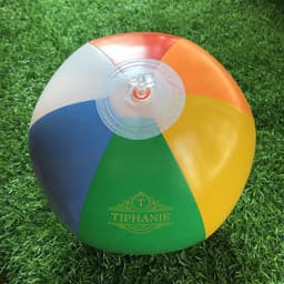 A PVC inflatable beach ball featuring six vibrant colours: red, orange, yellow, green, blue, and purple. It has a logo.