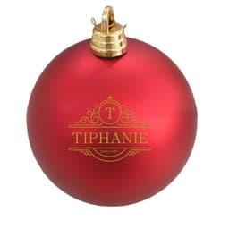 A shiny red Christmas tree ball with a gold decorative logo and a golden top attachment.