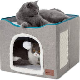 A grey foldable cat cube house with a plush interior, featuring two cats—one inside and one on top.