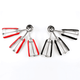 A large multifunctional stainless steel ice cream scoop with red and black silicone grips, featuring a shiny metallic scoop.