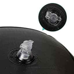 A close-up of a black inflatable toy with a transparent valve for inflating and deflating.