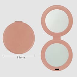 A pink PU mini pocket makeup mirror with two reflective surfaces, measuring 85mm in diameter.