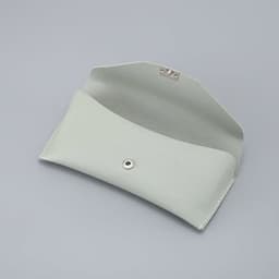 A light grey glasses case with a snap closure, featuring a smooth textured surface and no visible pattern.