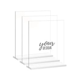 A set of clear acrylic sign holders in various sizes, featuring a base for stability and customizable designs.