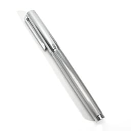 A silver fountain pen with a textured barrel and a clip, featuring an ink converter mechanism.