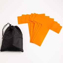 A black storage bag next to several orange pickleball court marker lines on a white background.