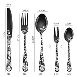 A stainless steel flatware set featuring black utensils with floral patterns, including a knife, fork, and spoons.