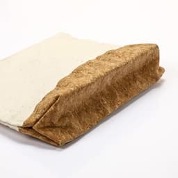An eco-friendly pouch featuring a natural cork base and a cream canvas top, with a simple zipper closure.