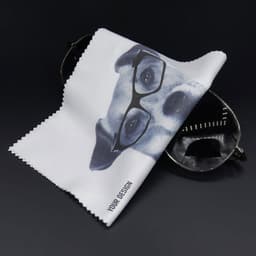 A personalised glasses cleaning cloth featuring a dog's face wearing glasses, with a black background.