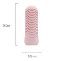 A pink silicone mat pouch with measurement markings, designed for heat resistance. It has a logo on the surface.