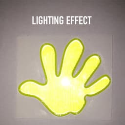 A reflective hand-shaped sticker in bright yellow with a glowing effect against a light background.