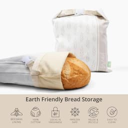 A set of earth-friendly bread storage bags, featuring a beige and patterned design, showcasing a loaf of bread inside.