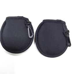 A black golf ball cleaning pouch with a clip, featuring a smooth, rounded design and a zip closure.
