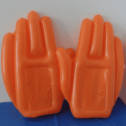 An inflatable cheering hand in bright orange, featuring two oversized hand shapes.