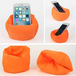 An orange bean bag phone holder displays a smartphone, featuring a soft, flexible design. It includes a logo.