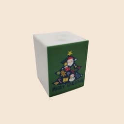 A square silicone night light in white with a green Christmas tree design featuring Santa and festive decorations.