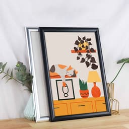 A black and silver front loading aluminium snap poster frame displays an illustrated scene with a cat, plants, and a lamp.