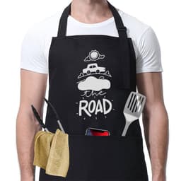 A black adjustable cooking apron with pockets, featuring kitchen utensils like a spatula and a towel.