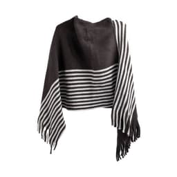 A brown and white striped cotton tassel poncho with fringe detailing. The fabric is soft and lightweight.