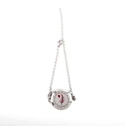 A silver essential oil diffuser locket pendant on a chain bracelet, featuring a decorative design.