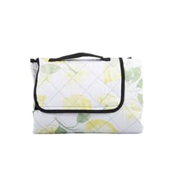 A folded picnic mat with a floral design in yellow and green, featuring a black carry handle and a quilted pattern.