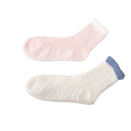 Two pairs of cosy crew socks in pink and white with blue accents, featuring a fuzzy texture and anti-skid design.