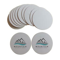 A stack of white custom disposable absorbent paper coasters, featuring a logo with mountains and text.