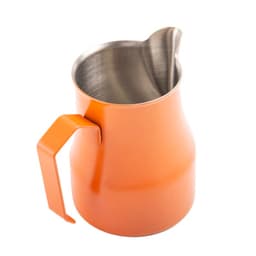 An orange stainless steel milk frothing pitcher with a curved spout and a sturdy handle. It has a branding logo.