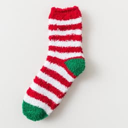 A fuzzy sock featuring red and white stripes with a green heel. The sock has a soft, plush texture.