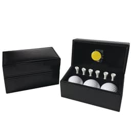 A black leather box containing three white golf balls, a yellow golf ball, and five white tees.