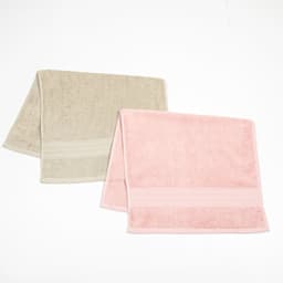 Two hand towels in beige and pink, featuring embroidered detailing and a soft textured finish.