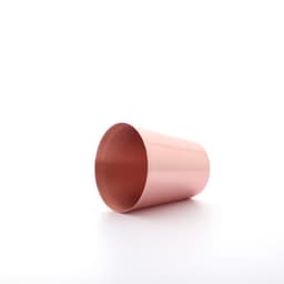 A 2 oz. copper shot glass with a shiny exterior, featuring a smooth, reflective surface.