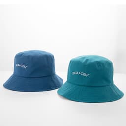 Two bucket hats in blue and teal, featuring a logo on the front.