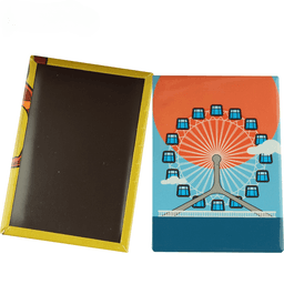 A tinplate fridge magnet featuring a colourful illustration of a ferris wheel against a vibrant sunset background.