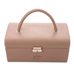 A jewellery box with a handle, featuring a sleek design in a soft beige colour and a metallic clasp.