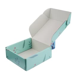 A small custom shipping packaging box in light blue with floral design, partially open to reveal the interior.