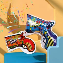 An inflatable gun in vibrant colours featuring festive designs, accompanied by colourful confetti.