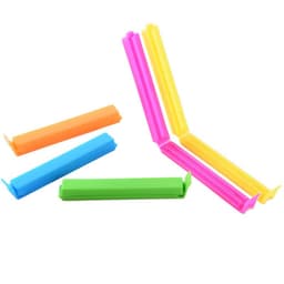 Colourful plastic food sealing clips in pink, yellow, green, orange, and blue arranged in a scattered layout.