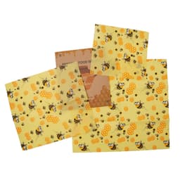 A set of three beeswax food wraps in yellow featuring bee and honeycomb patterns, with a branded sticker included.