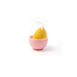 A pink case containing a yellow beauty sponge, shaped like an egg with a transparent lid.